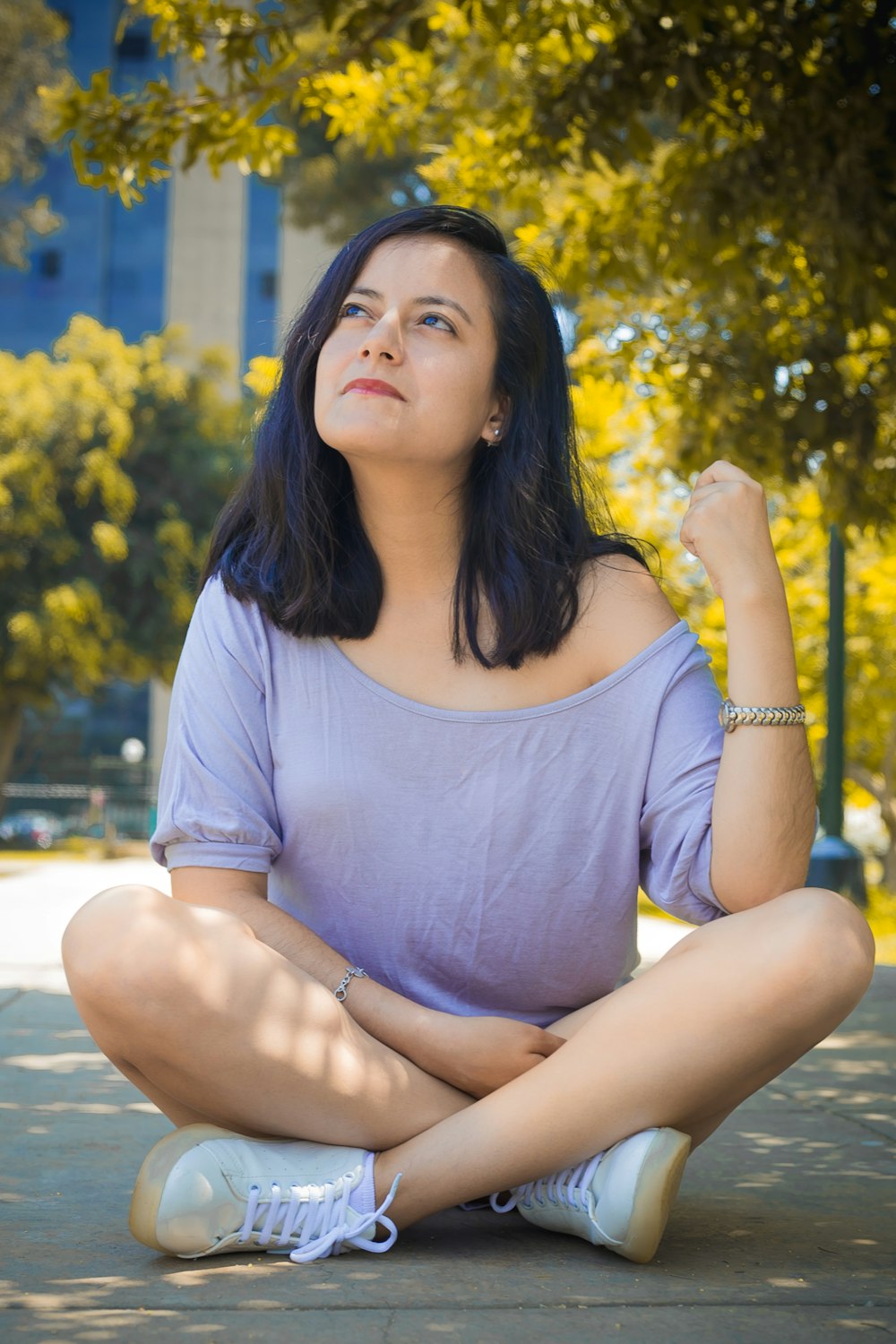 woman sitting on gray floor