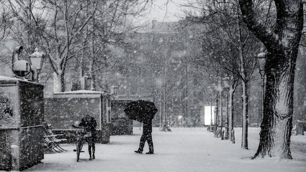 man walking on snowy steert