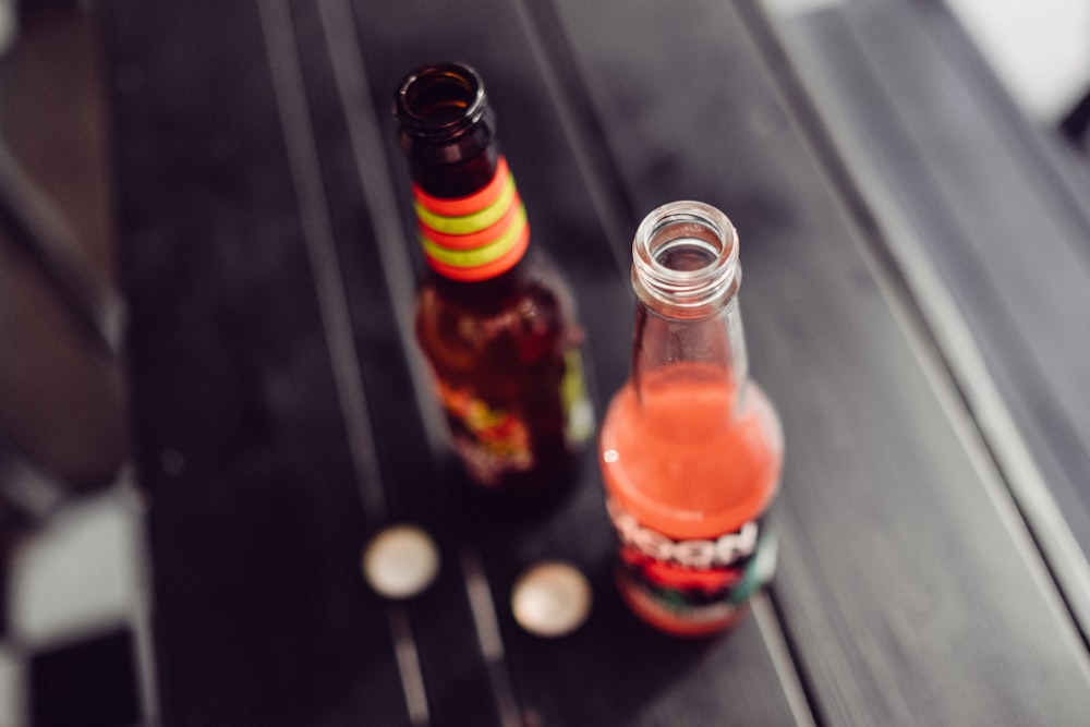 selective focus photography of two glass bottles