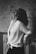 gray scale woman leaning on railings