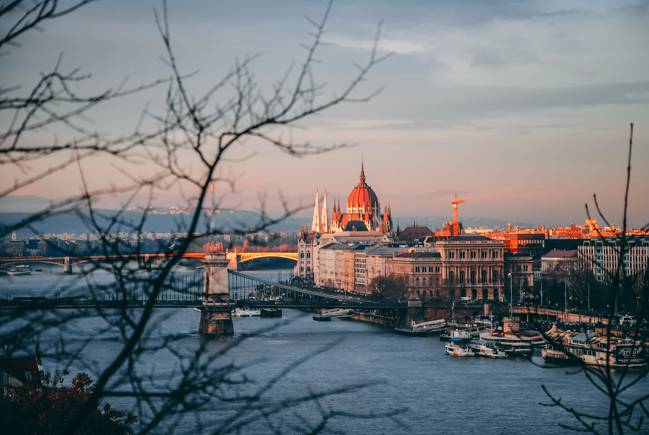 Budapest parliament and Danube at night, chain bridge in foreground