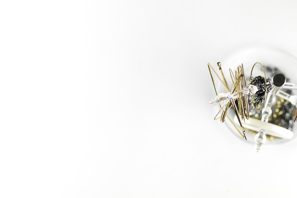 a close up of a clock on a white surface