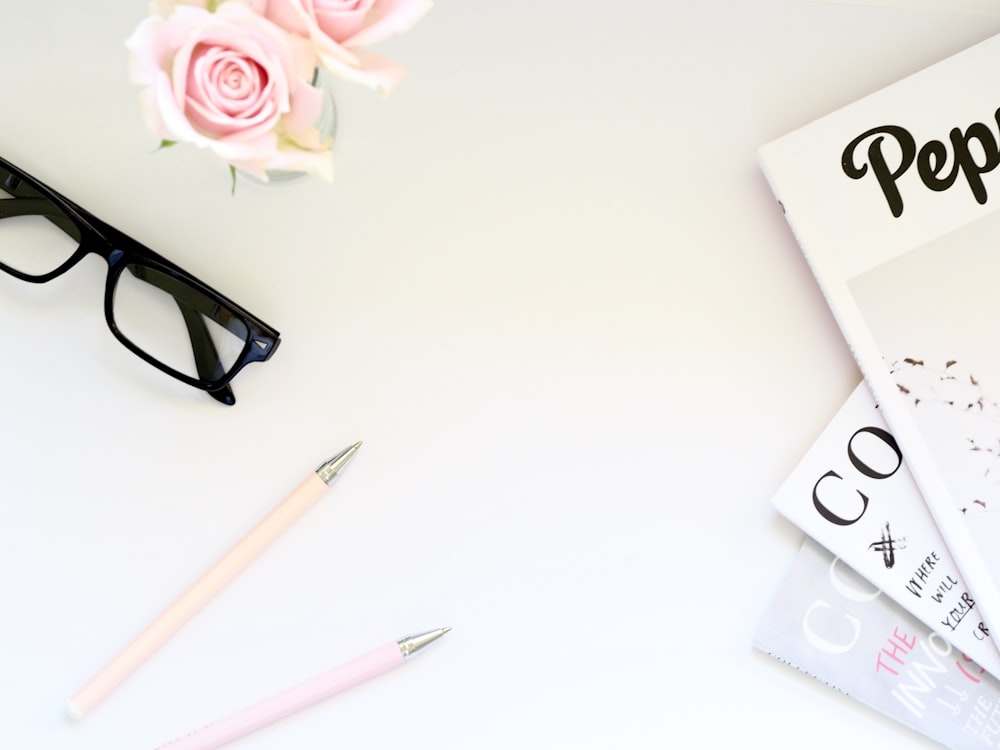 eyeglasses with black frames on white surface