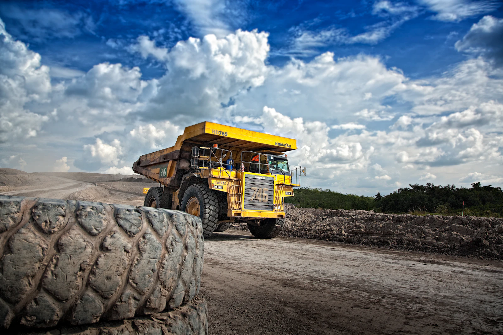 Large industrial crane lifting oversized heavy equipment at a construction site