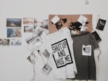 two white and gray text-printed hanging shirts