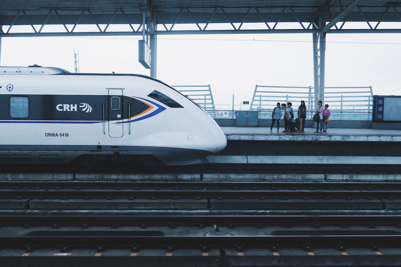 China Railway high-speed train waiting at a station platform