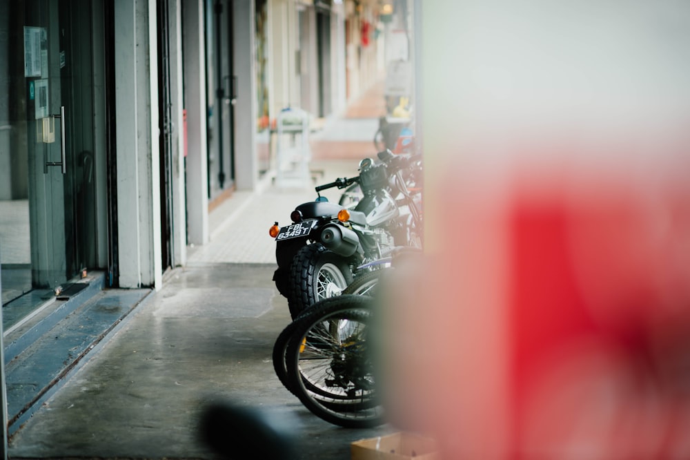 several motorcycles near glass door