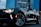 black convertible coupe parked near high-rise building
