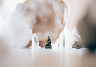 macro photography of black ceramic Gautama Buddha miniature