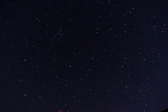 Delicate sparkles scattered across a dark sky, resembling the infinite possibilities within the akashic records.