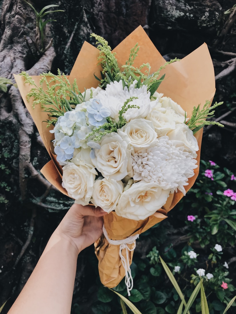White and cream bouquet wrapped in paper