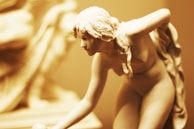 Side view of a full pose sculpture highlighting the smooth contours and realistic anatomy.