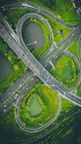 An aerial view of a complex highway interchange with multiple lanes and bridges.