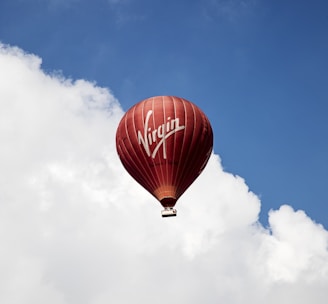 time lapse photography of flying Virgin hot air balloon