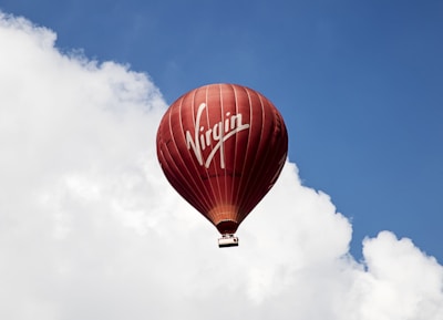 time lapse photography of flying Virgin hot air balloon