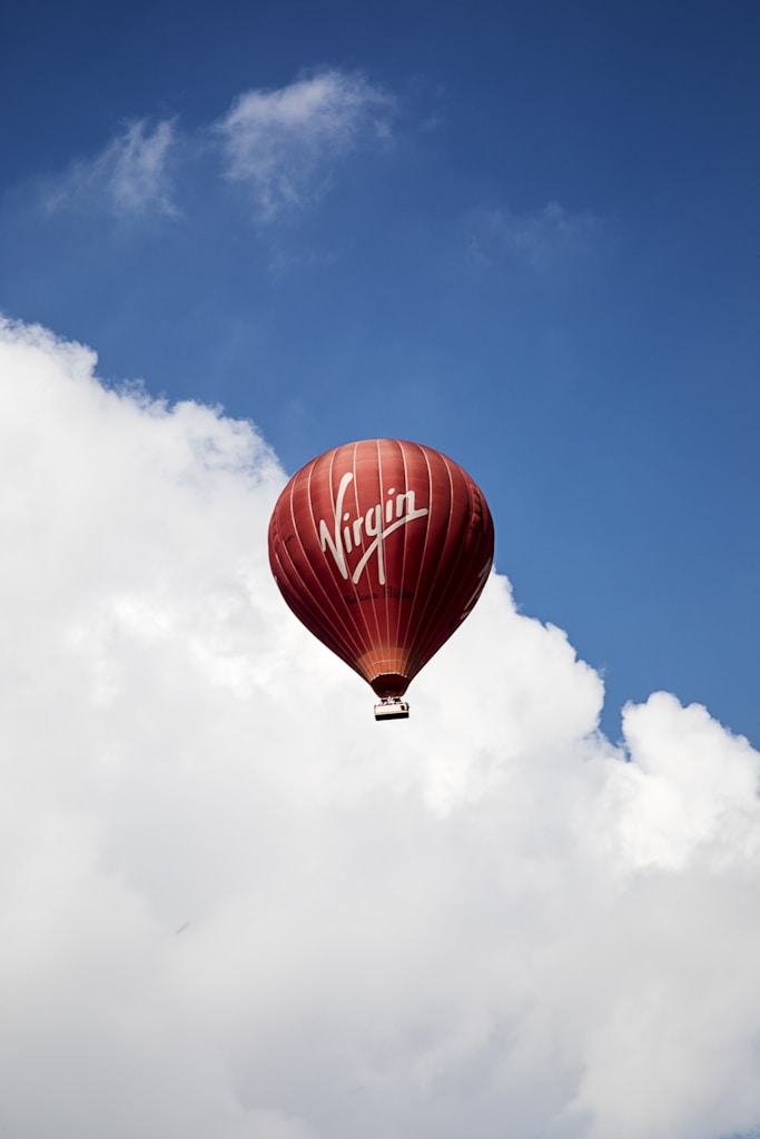 time lapse photography of flying Virgin hot air balloon