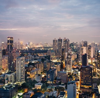 A photo showcasing the skyline of Bangkok, Thailand - including the Chao Praya River