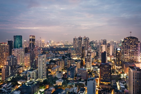 A photo showcasing the skyline of Bangkok, Thailand - including the Chao Praya River