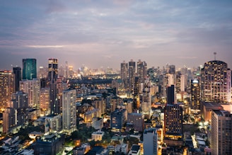 A photo showcasing the skyline of Bangkok, Thailand - including the Chao Praya River