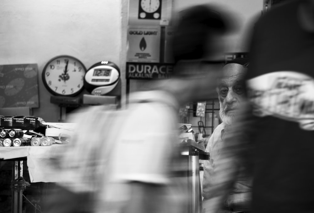 a blurry photo of a man working at a coffee shop