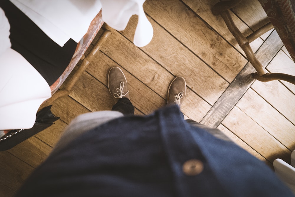 person standing showing brown sneakers