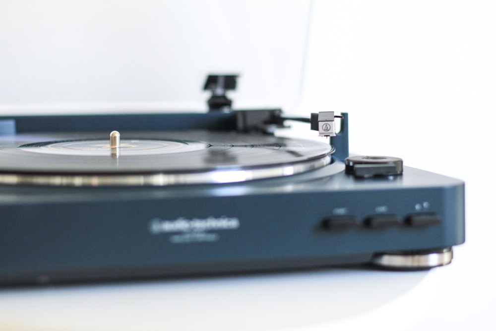 selective focus photography of turntable