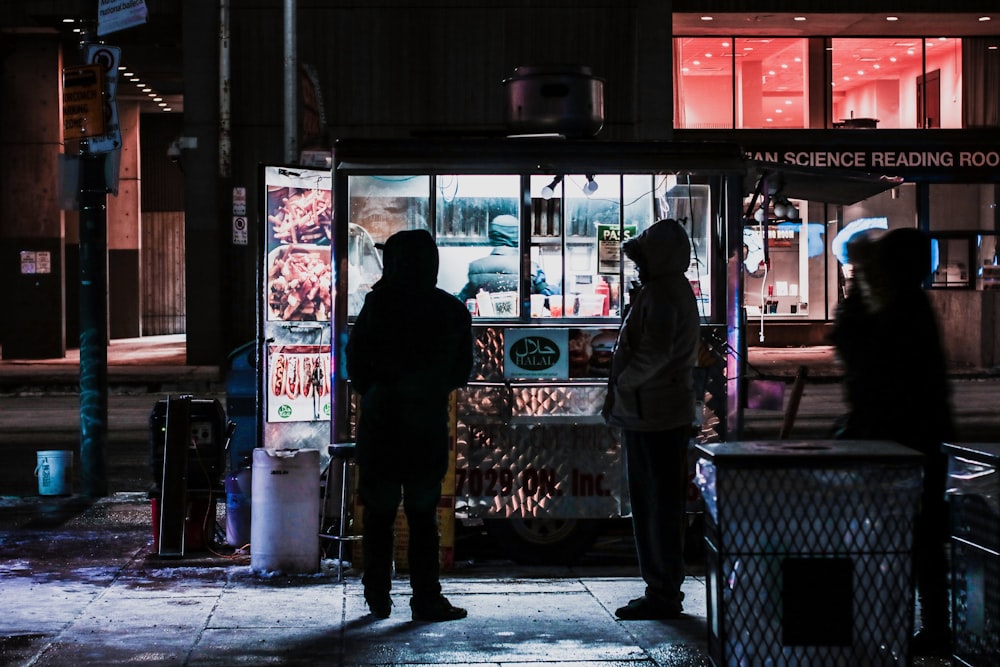 group of people standing in store