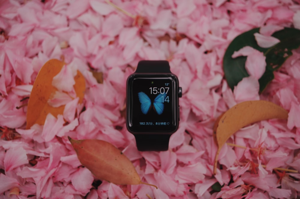 space black aluminum case Apple Watch with black Sport Band on pink petals