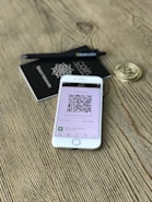 silver iPhone 6 on brown surfacde