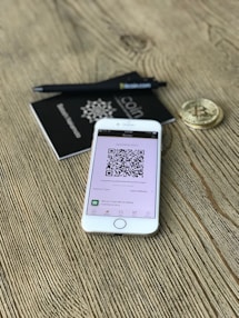 silver iPhone 6 on brown surfacde