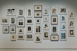 A gallery wall showcasing framed minimalist graphic design prints.