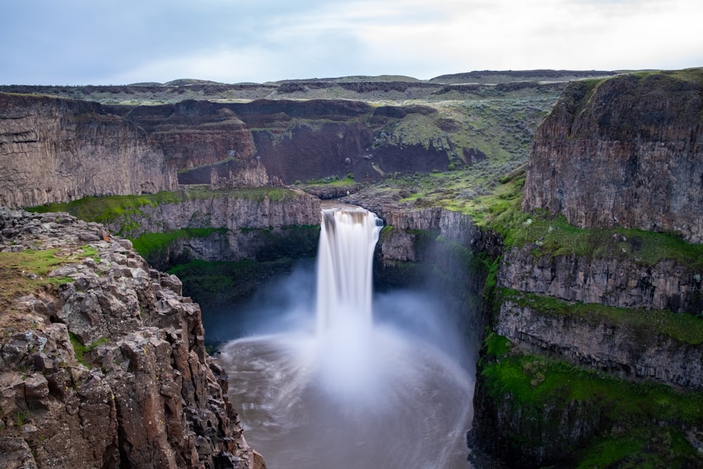 waterfalls beside mountain