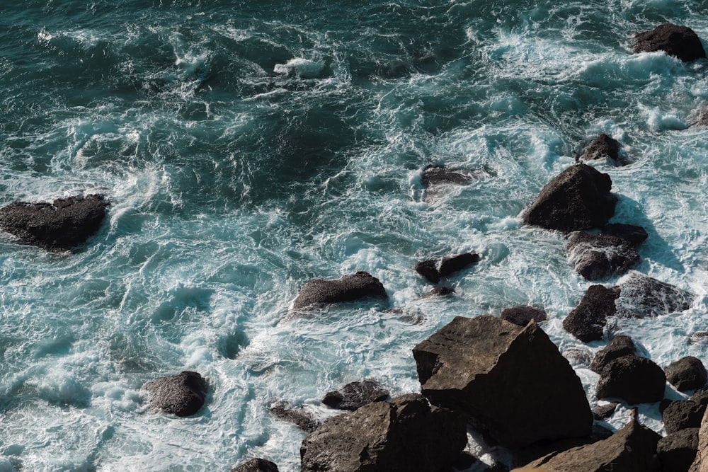 birds eye view of body of water and rock formation