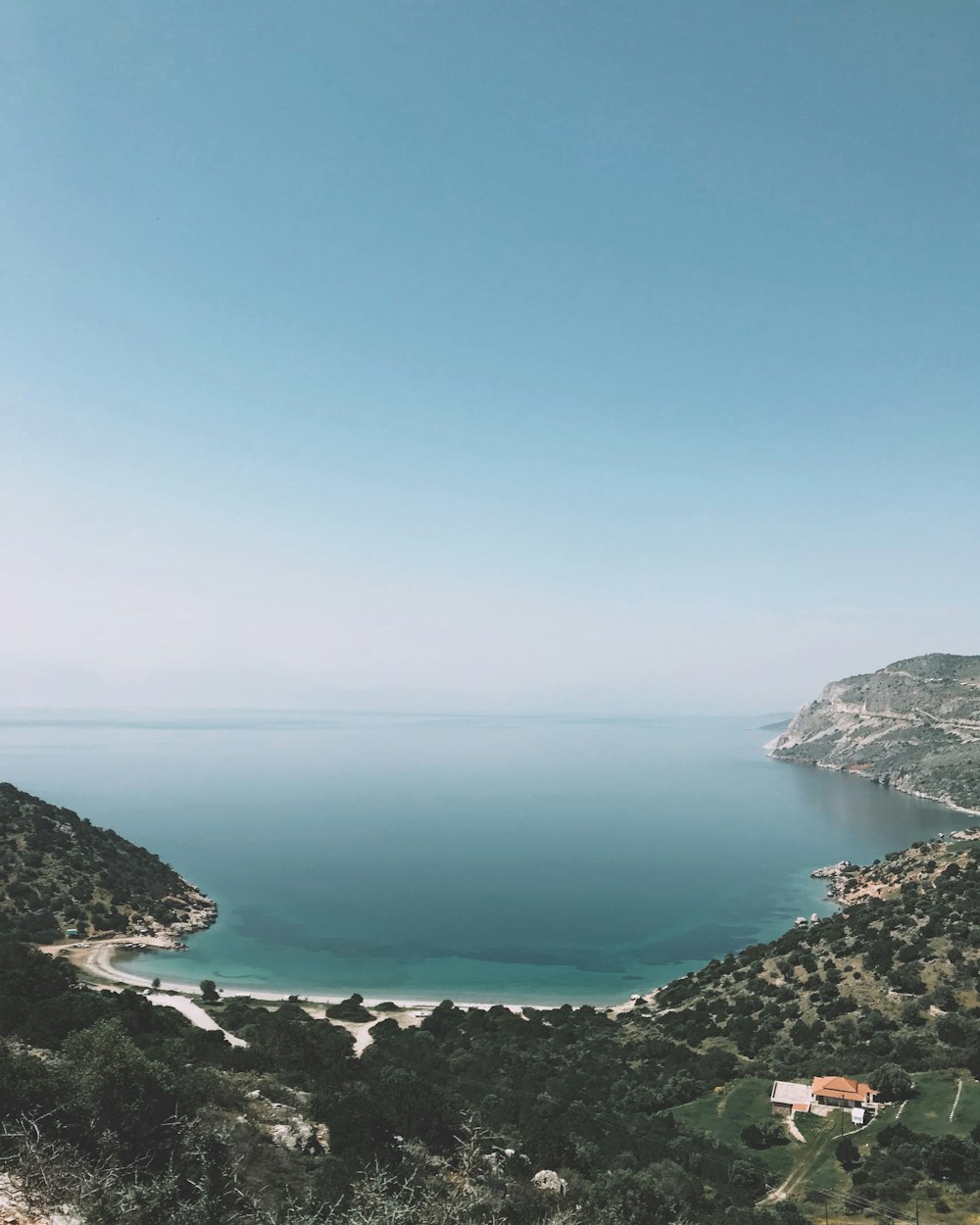 aerial photography of mountains near sea at daytime