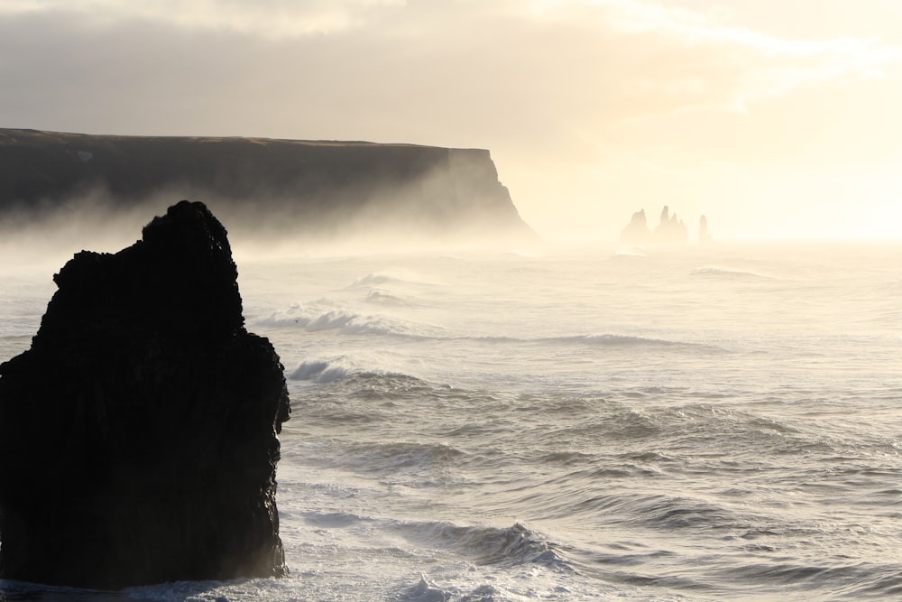 sea waves crashing through rocks