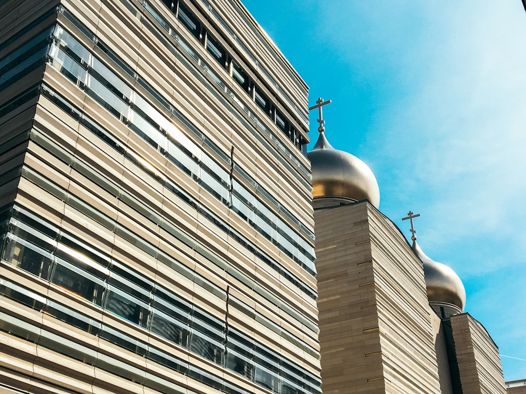 low-angle photography of brown church