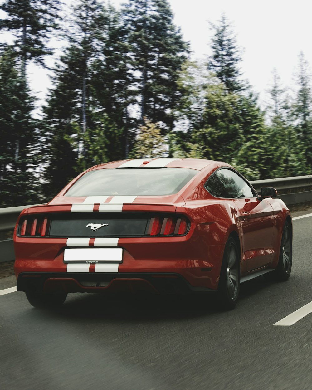red Ford Mustang on road