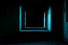 open door beside white paint wall