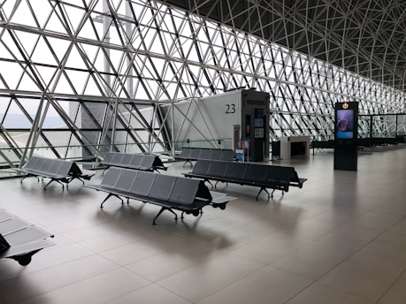 black metal gang chairs on white ceramic flooring