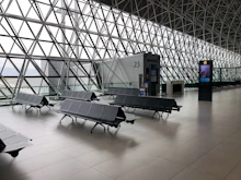 Passengers waiting at an airport boarding gate