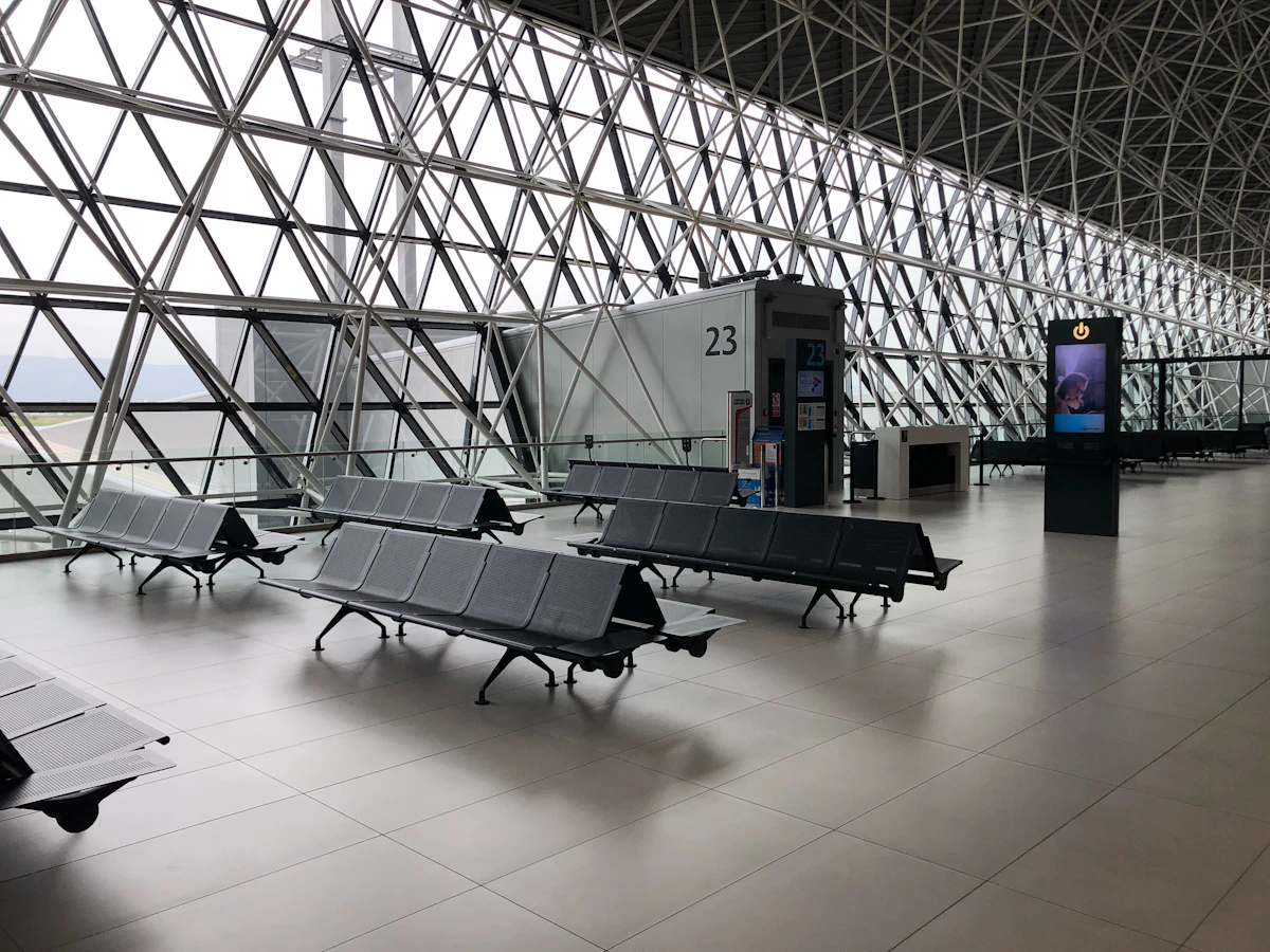 Passengers waiting at an airport boarding gate