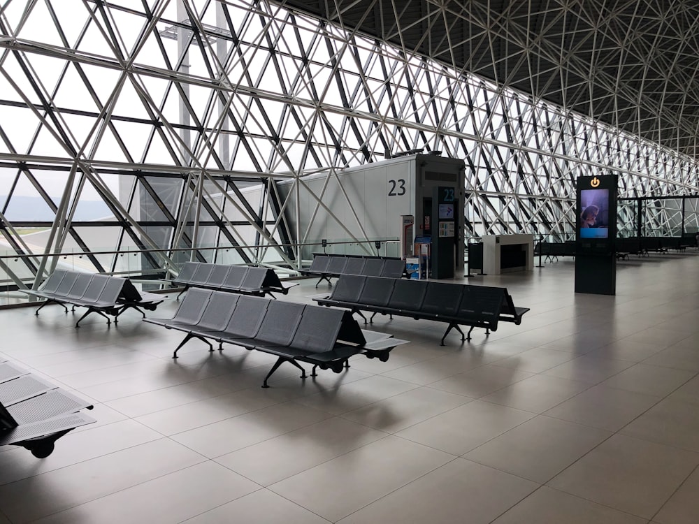 black metal gang chairs on white ceramic flooring