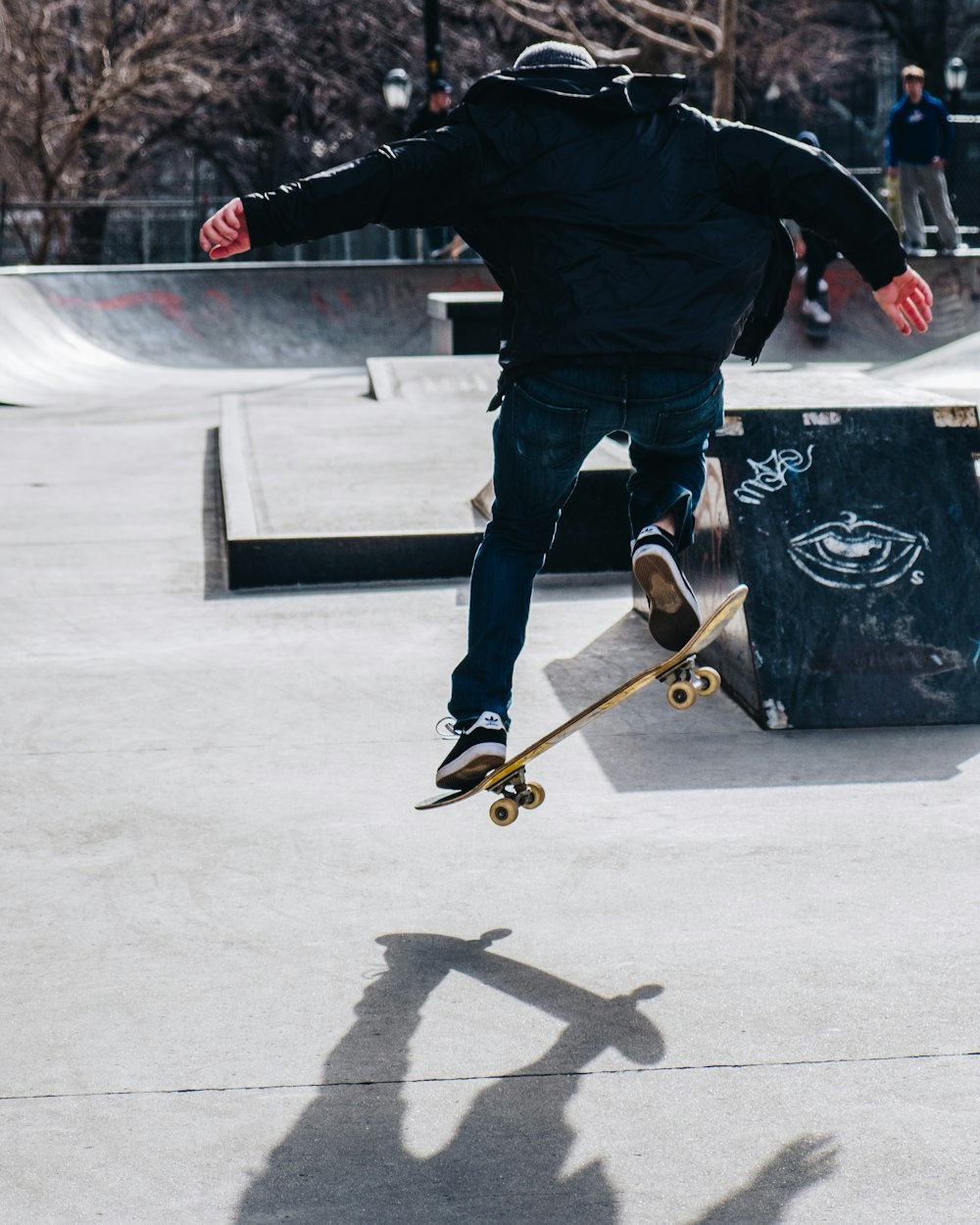 man riding on skateboard and performing tricks