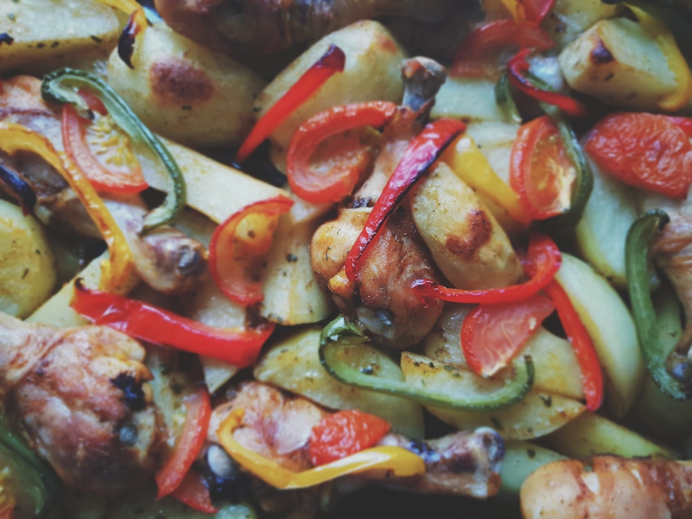 a close up of a plate of food with meat and veggies