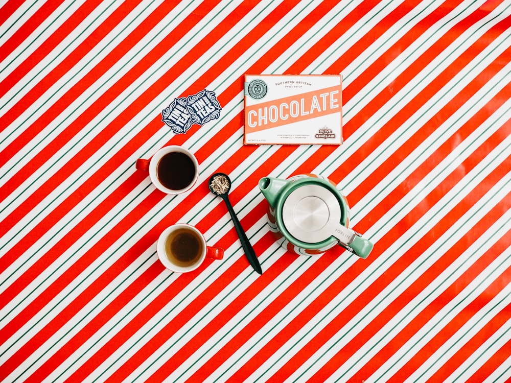 cup of coffee on red and white striped surface