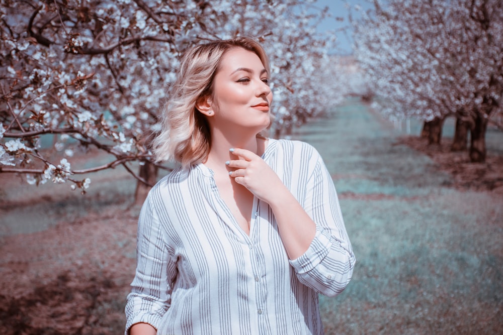 woman surrounded by trees at daytime