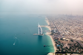 an aerial view of the burj al arab in the middle of the ocean