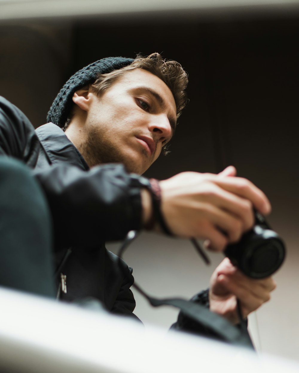 bottom view of man holding camera