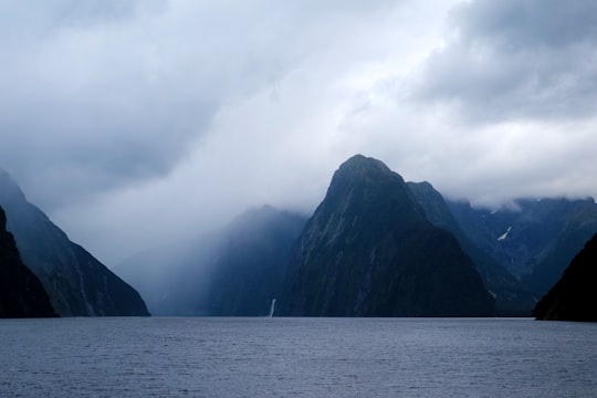 hills between body of water in Milford Sound New Zealand