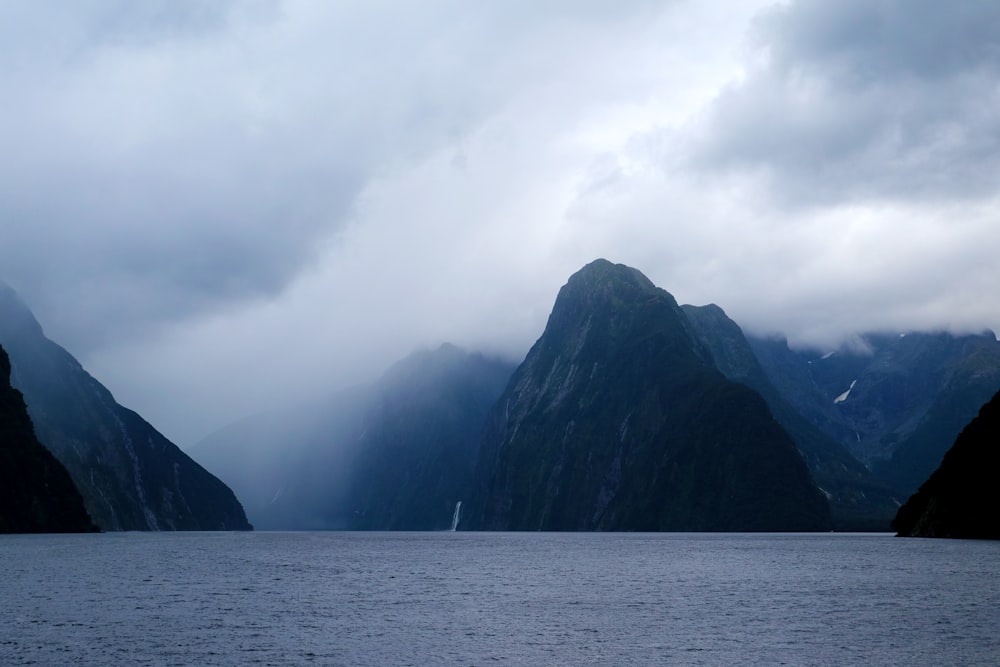 hills between body of water